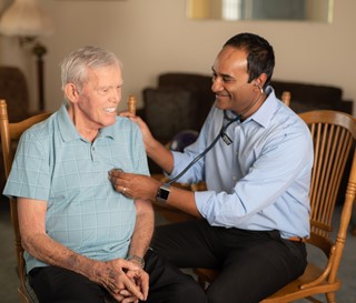 Gobi Paramanandam, Medical Director checking heart rate of patient